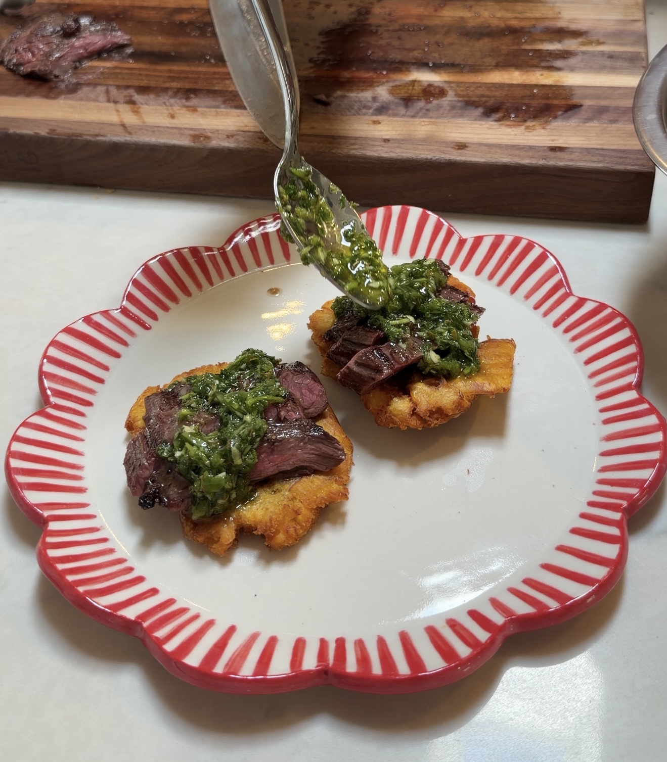 Tostones topped with churrasco & Jalapeño chimichurri